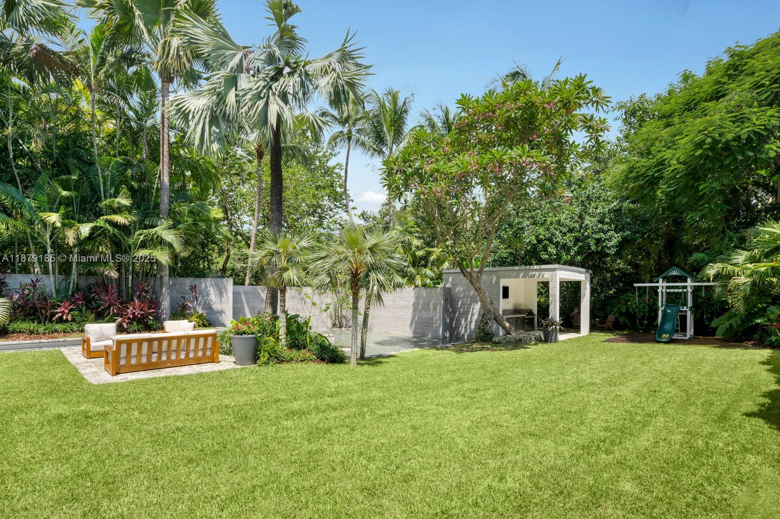 3651 St Gaudens Road Coconut Grove, FL 33133 - Photo 22 of 70 a white house that has a tree in front of it