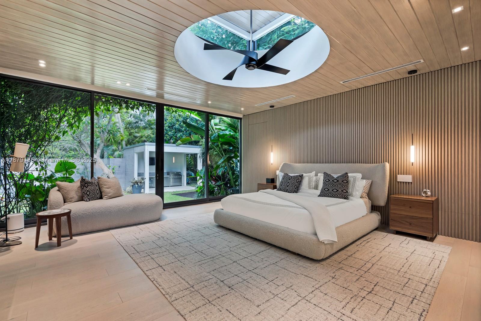 3651 St Gaudens Road Coconut Grove, FL 33133 - Photo 24 of 70 a bedroom with a large bed and a large window