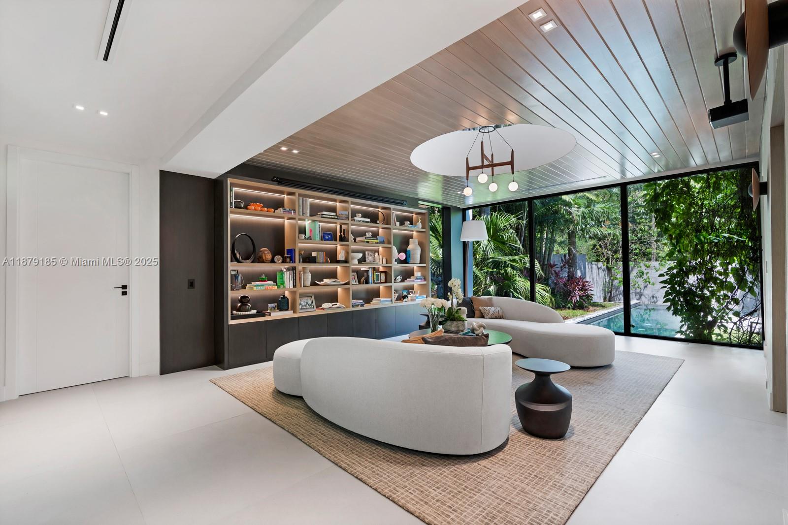 3651 St Gaudens Road Coconut Grove, FL 33133 - Photo 3 of 70 a living room with furniture and a large window
