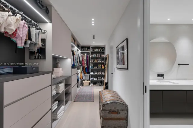 a bathroom with a sink toilet a mirror and shower