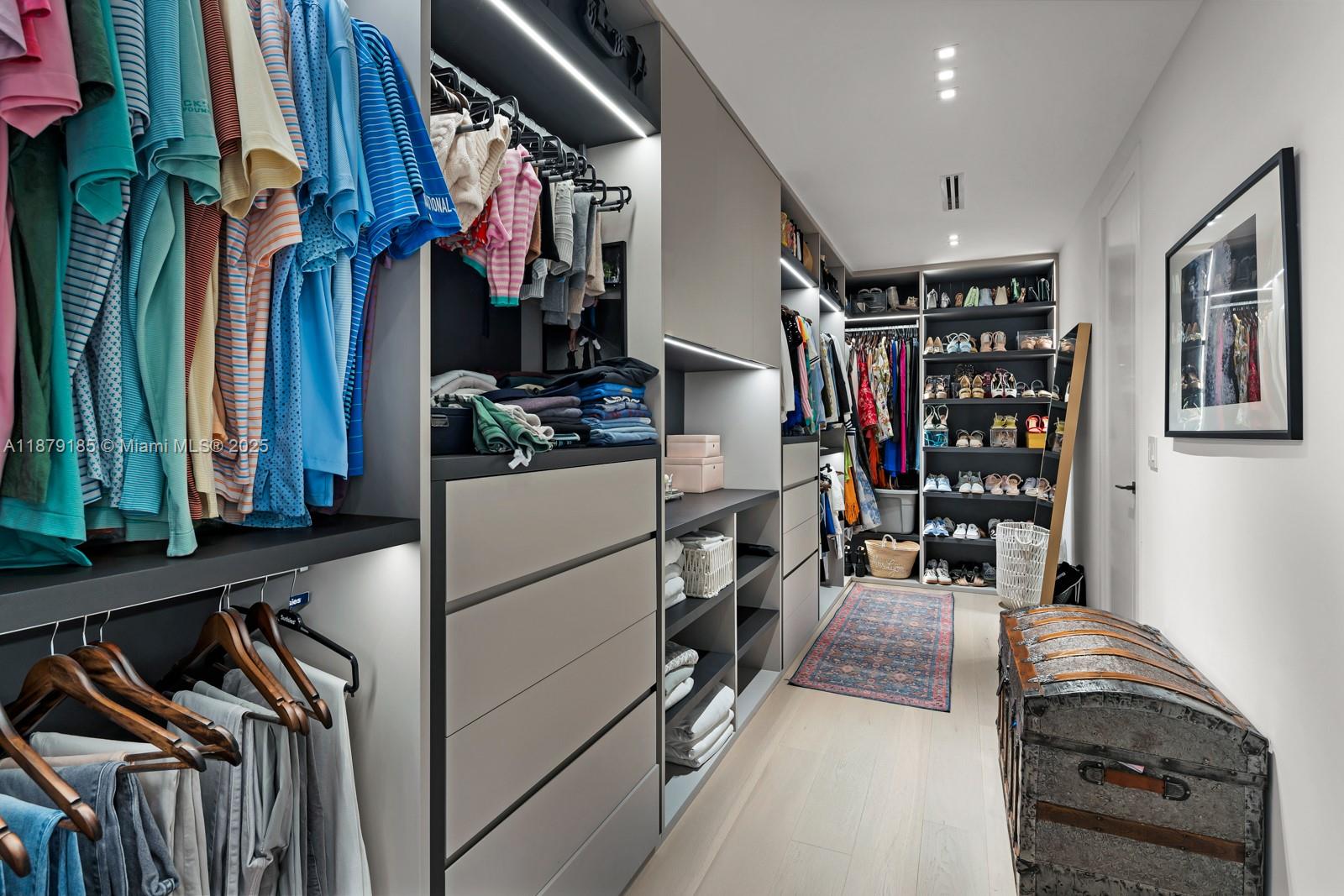 3651 St Gaudens Road Coconut Grove, FL 33133 - Photo 32 of 70 a view of walk in closet with clothes and shoes