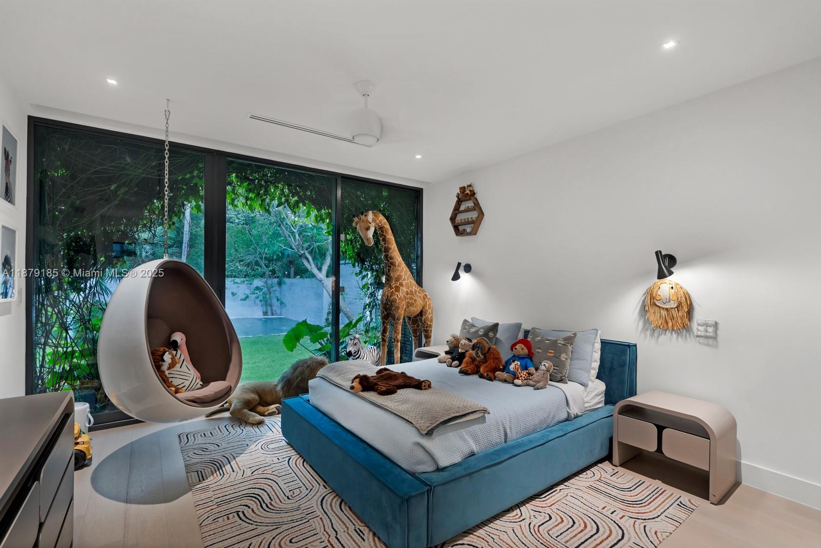 3651 St Gaudens Road Coconut Grove, FL 33133 - Photo 33 of 70 a living room with furniture and a large window