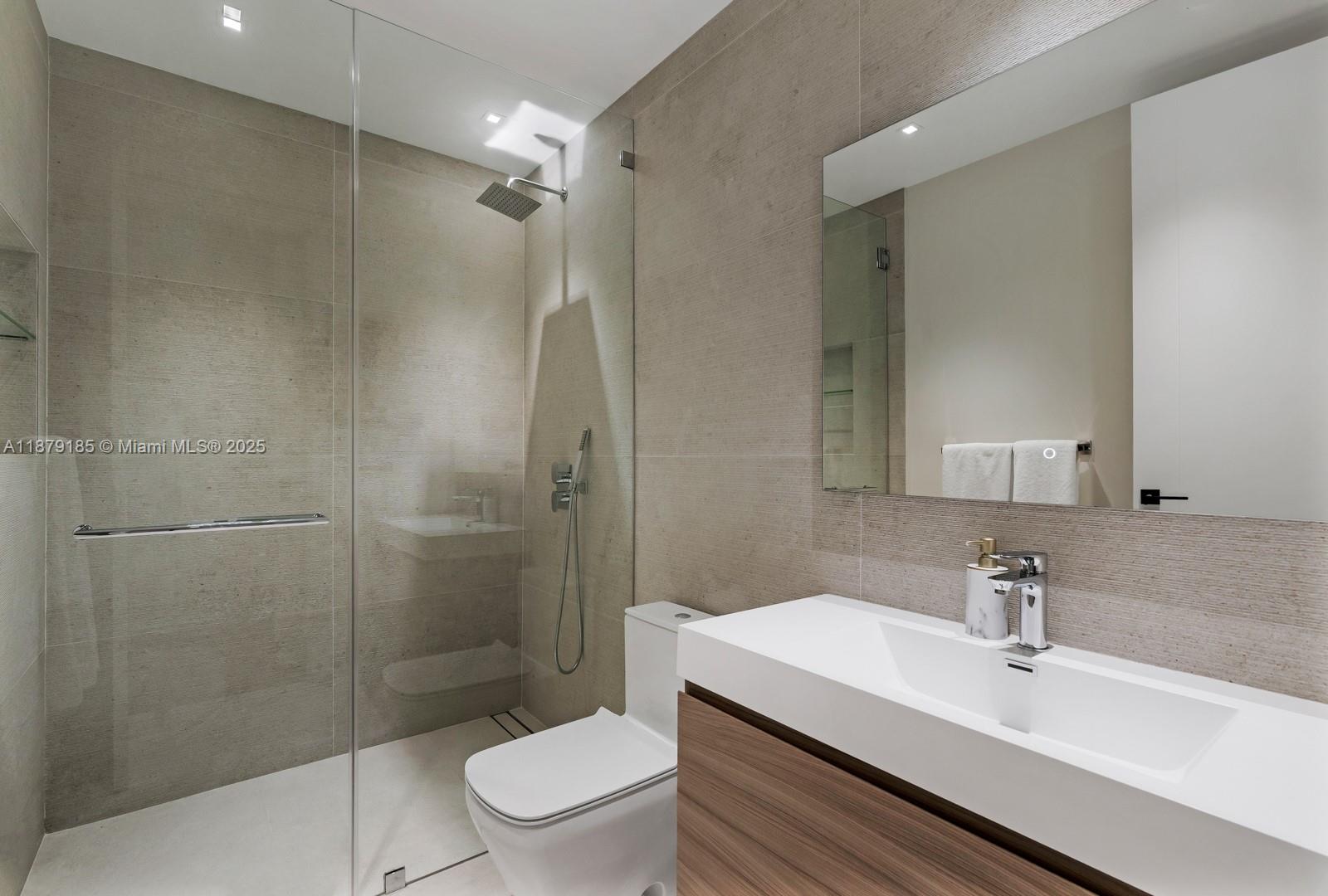 3651 St Gaudens Road Coconut Grove, FL 33133 - Photo 35 of 70 a bathroom with a sink toilet and shower