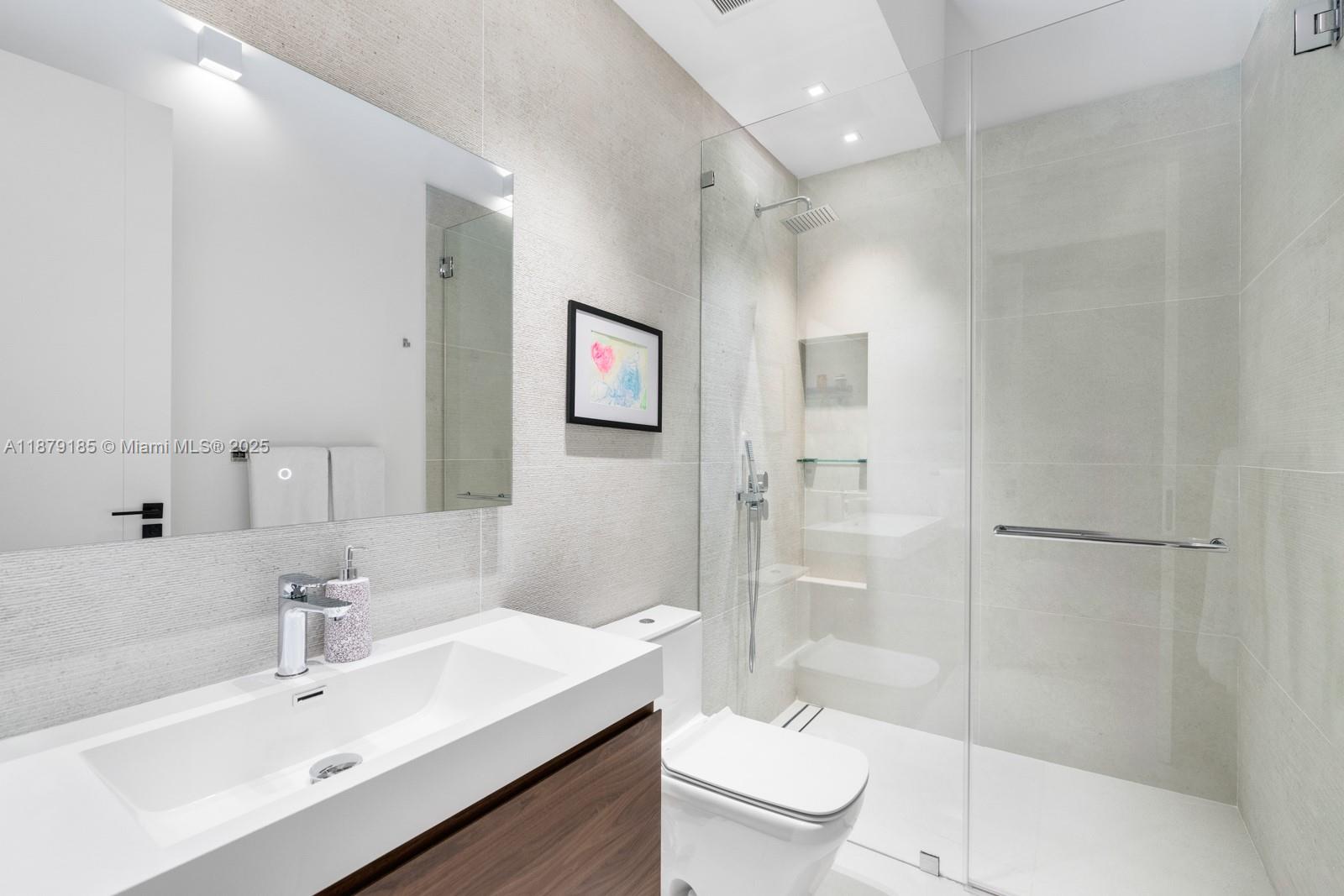 3651 St Gaudens Road Coconut Grove, FL 33133 - Photo 39 of 70 a bathroom with a sink toilet and shower