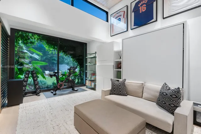 an aerial view of a house with garden space and street view