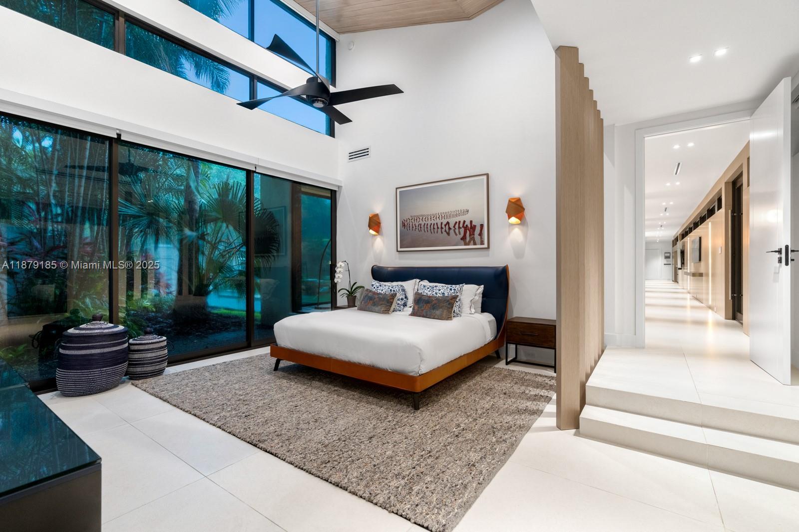 3651 St Gaudens Road Coconut Grove, FL 33133 - Photo 45 of 70 a living room with a bed and a large window