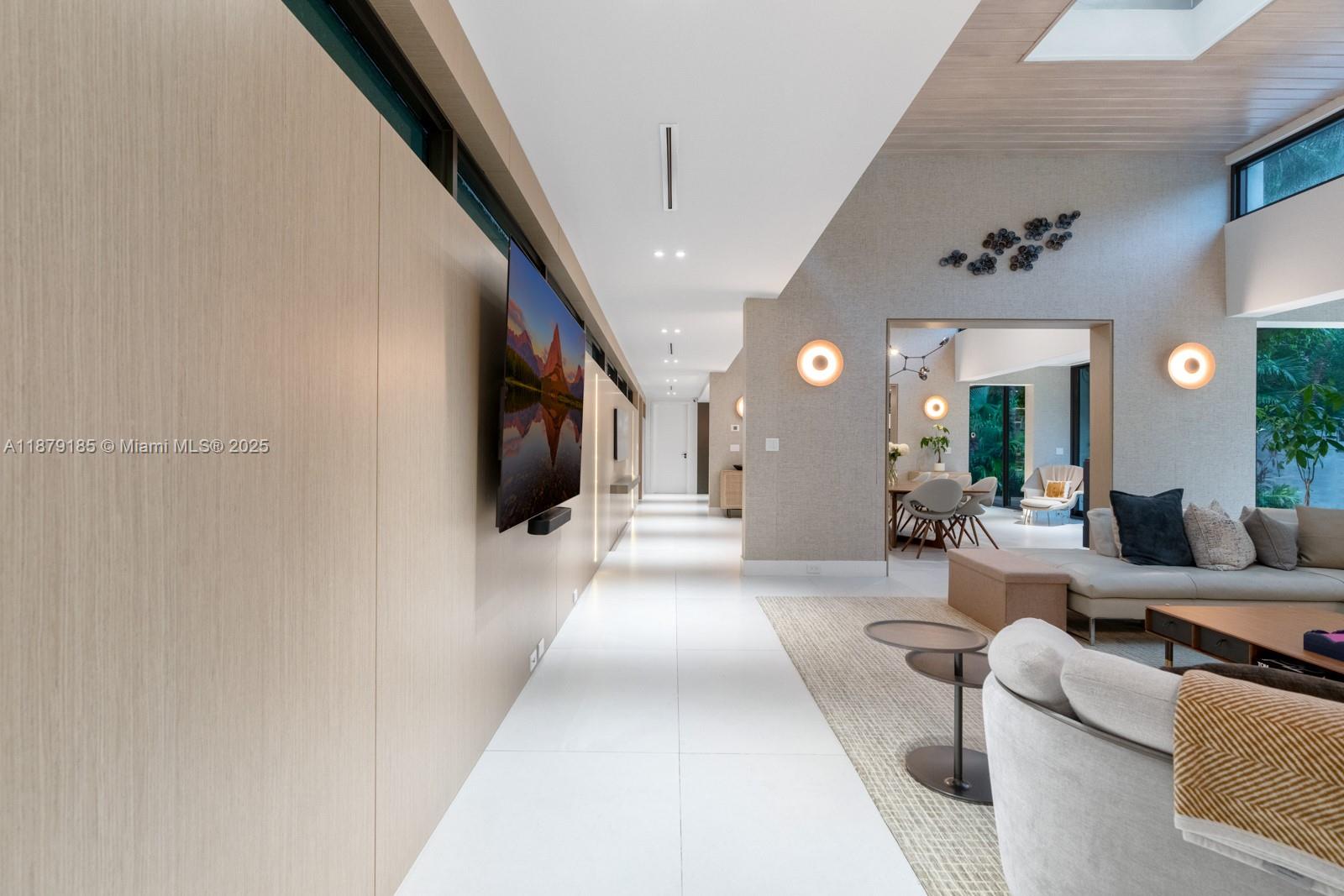 3651 St Gaudens Road Coconut Grove, FL 33133 - Photo 48 of 70 a living room with furniture and a flat screen tv