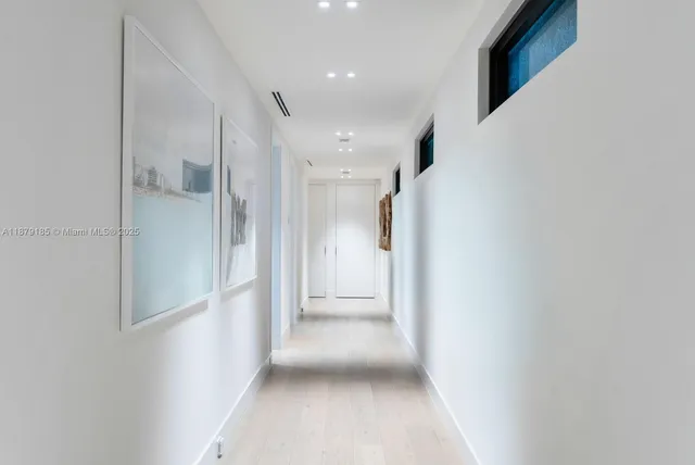 a front view of a house with a yard and a garage