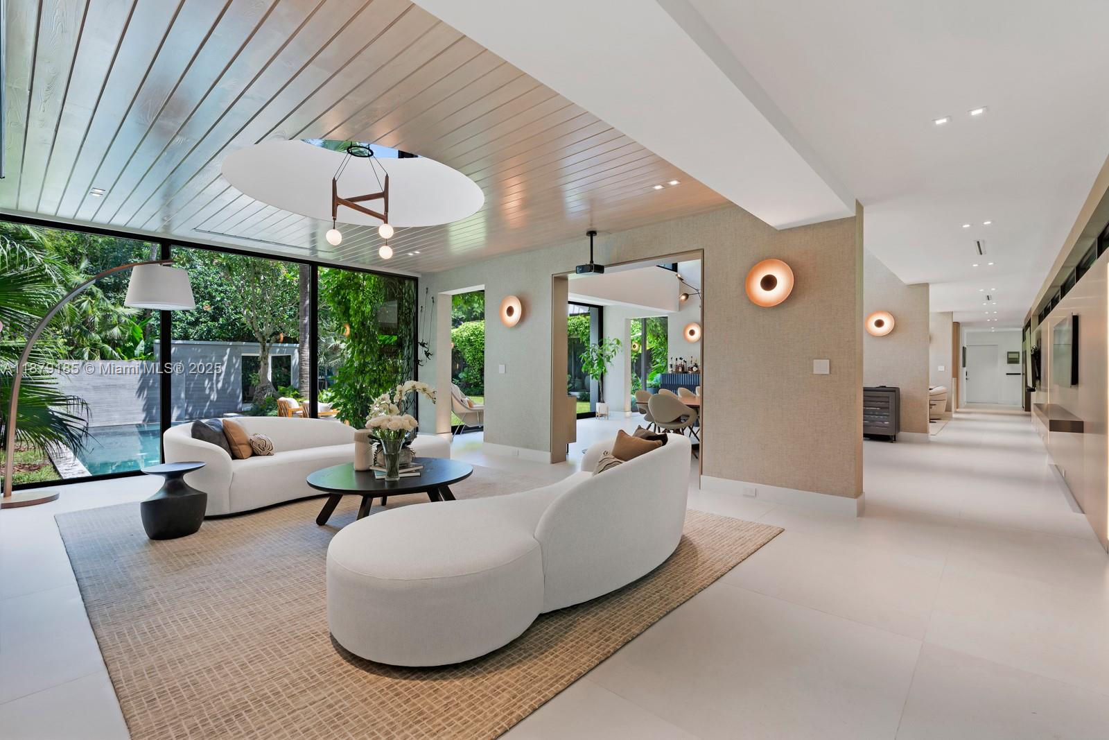 3651 St Gaudens Road Coconut Grove, FL 33133 - Photo 5 of 70 a living room with furniture and a large window