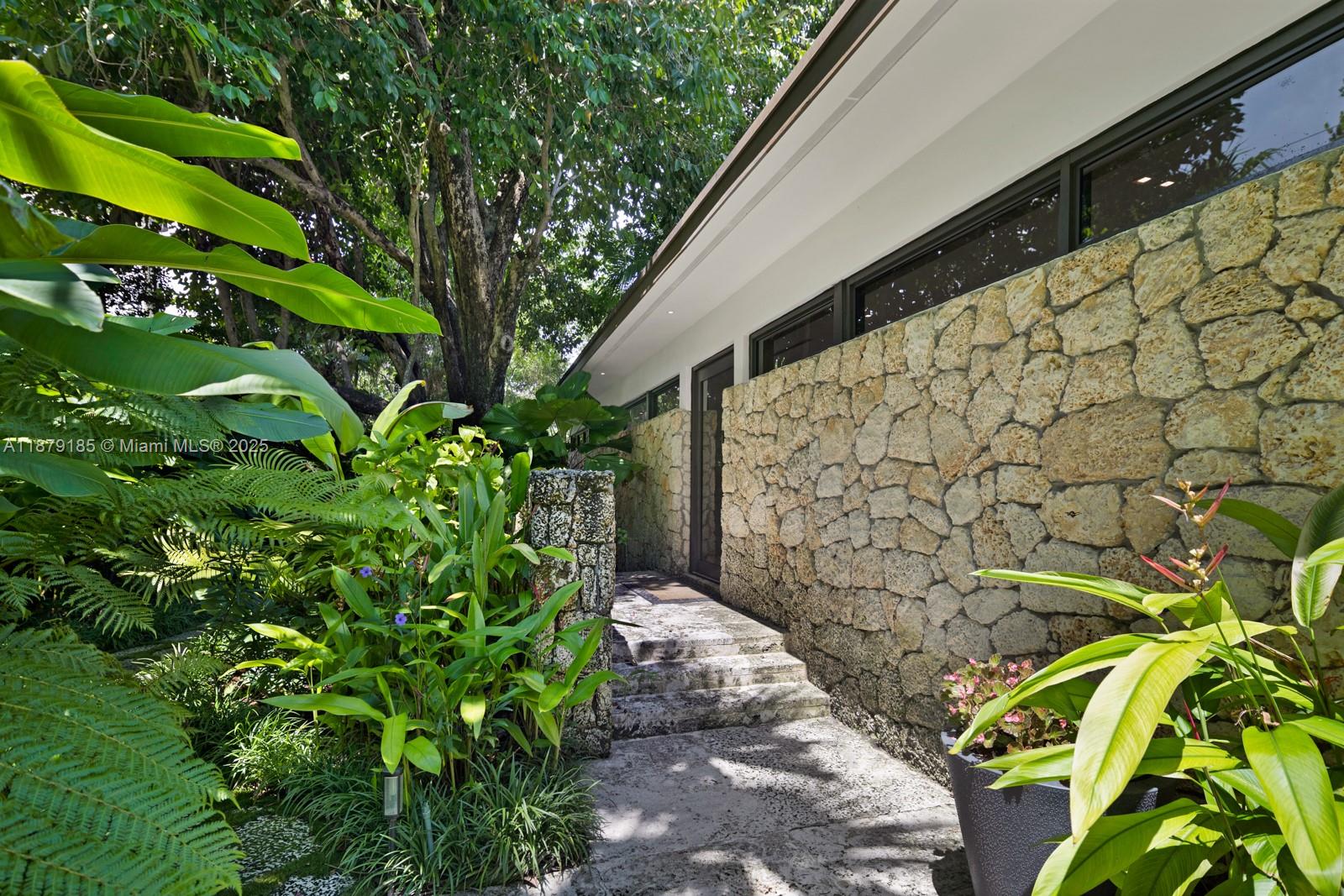 3651 St Gaudens Road Coconut Grove, FL 33133 - Photo 53 of 70 a backyard of a house with lots of green space