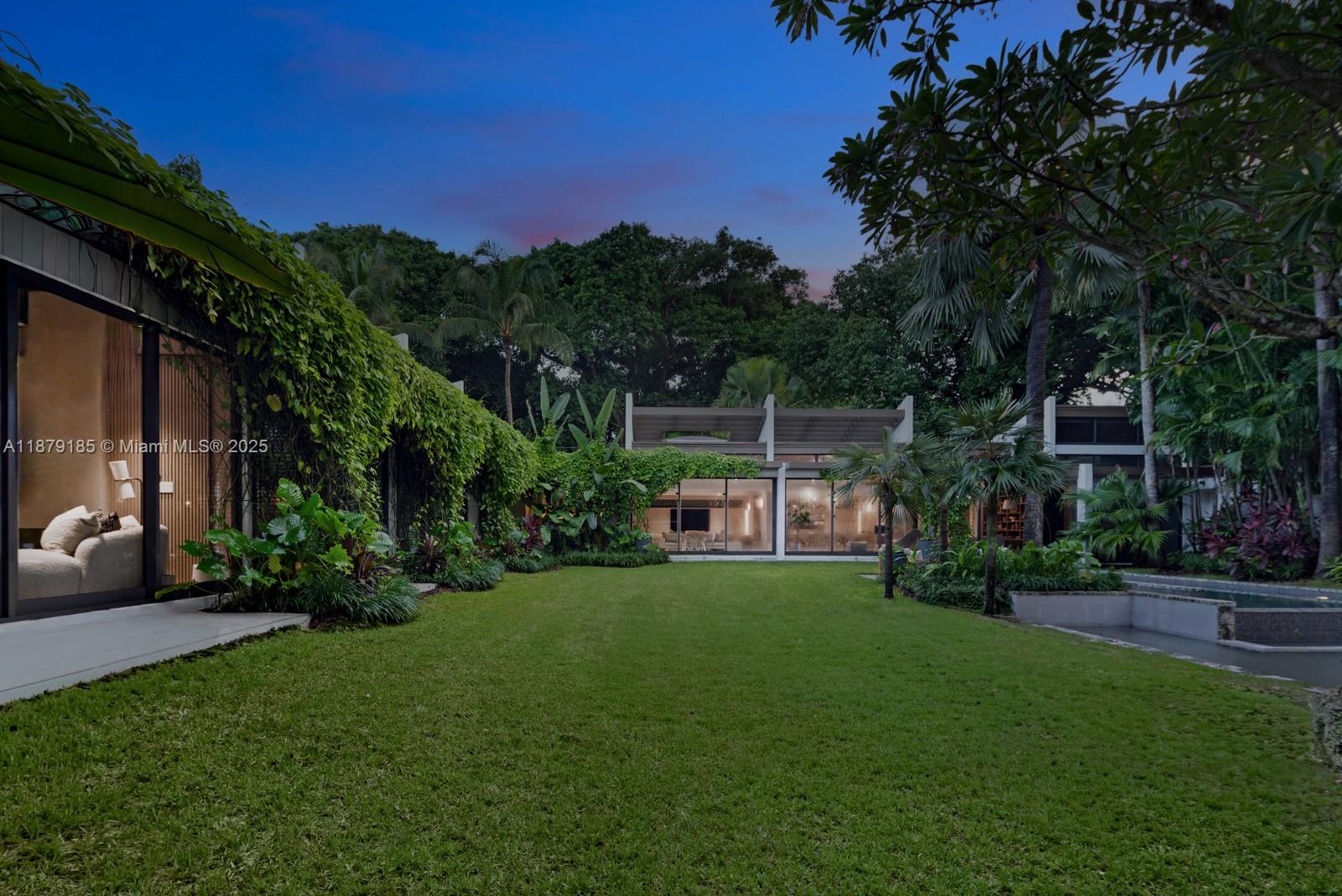 3651 St Gaudens Road Coconut Grove, FL 33133 - Photo 54 of 70 a view of a house with a yard