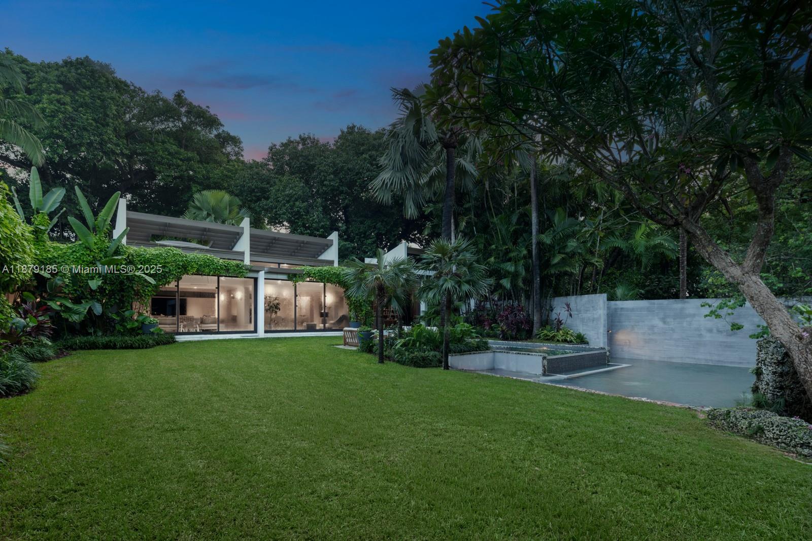 3651 St Gaudens Road Coconut Grove, FL 33133 - Photo 55 of 70 a view of a garden with patio