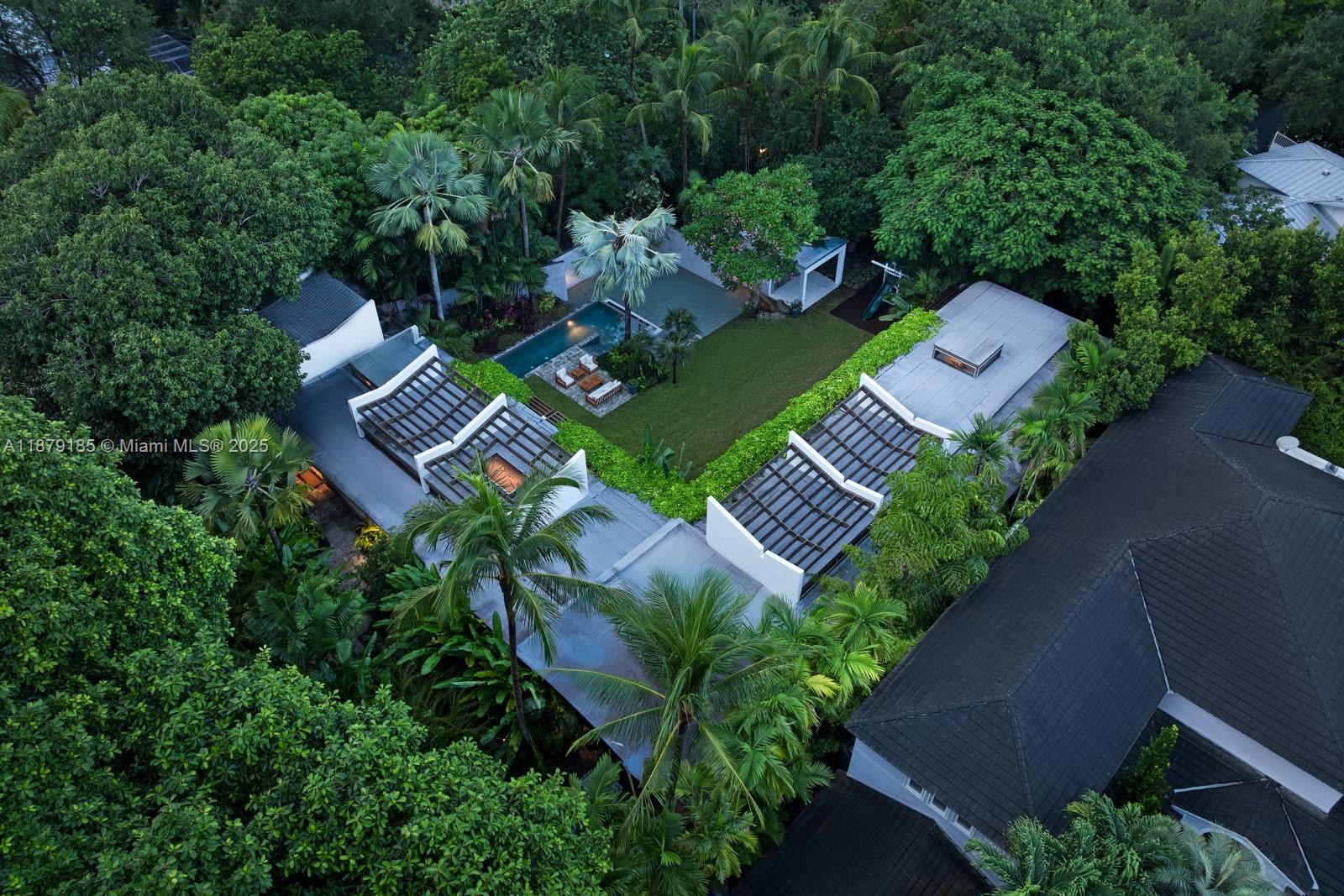 3651 St Gaudens Road Coconut Grove, FL 33133 - Photo 59 of 70 an aerial view of a house with garden space and street view