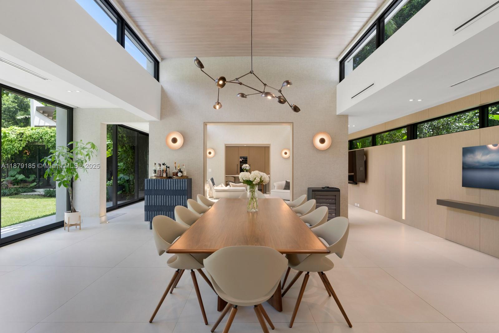 3651 St Gaudens Road Coconut Grove, FL 33133 - Photo 6 of 70 a view of a dining room with furniture window and wooden floor