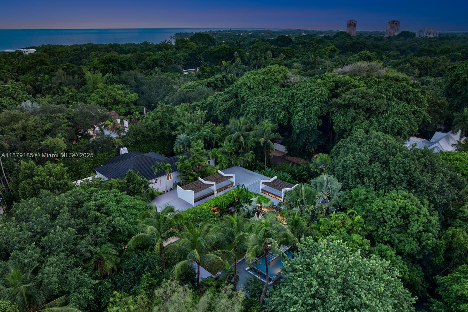3651 St Gaudens Road Coconut Grove, FL 33133 - Photo 62 of 70 an aerial view of residential house with outdoor space and trees all around