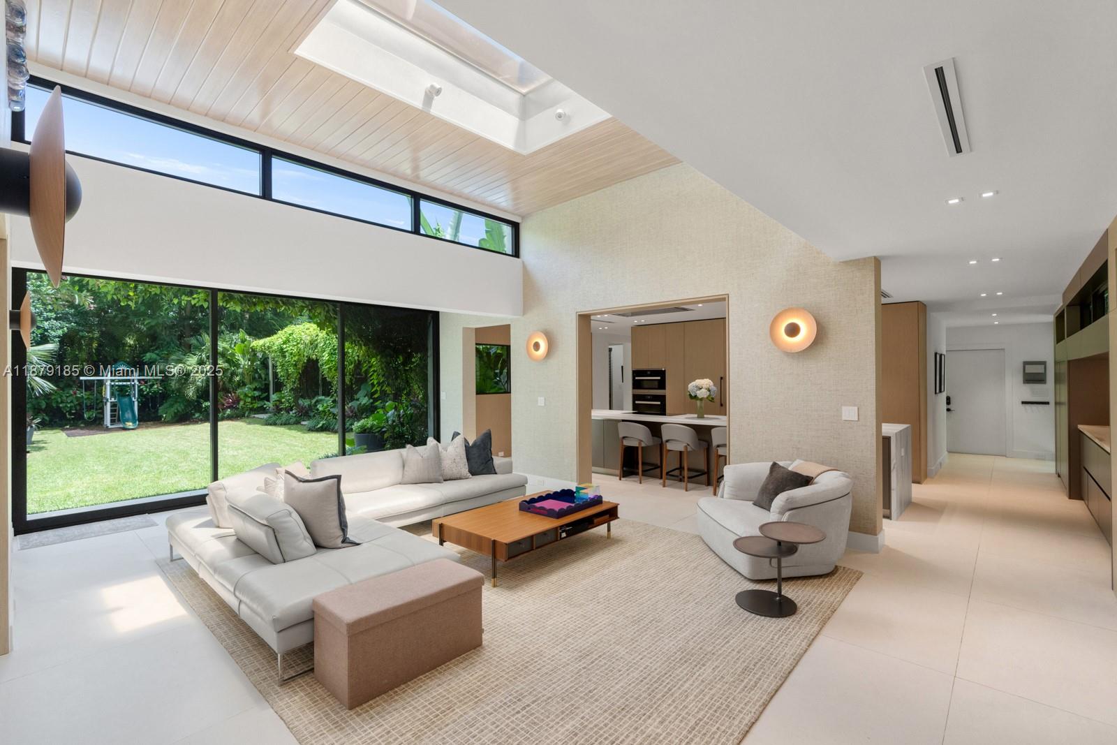 3651 St Gaudens Road Coconut Grove, FL 33133 - Photo 10 of 70 a living room with furniture and a large window