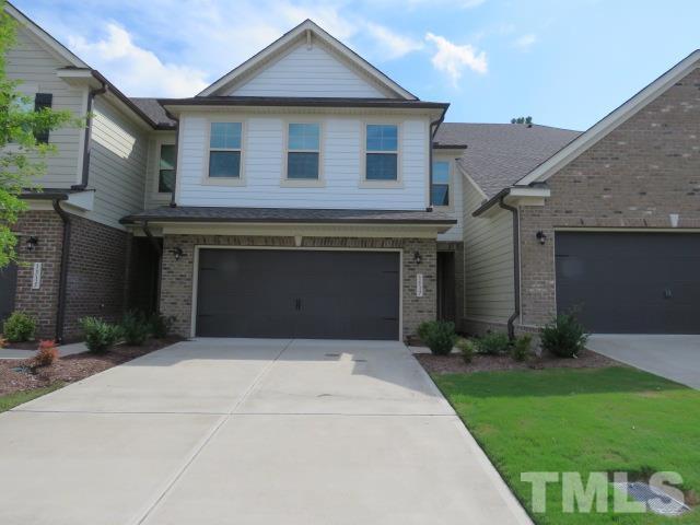1517 Catch Fly Lane Durham, NC 27713 - Photo 1 of 44 a front view of a house with a yard and garage