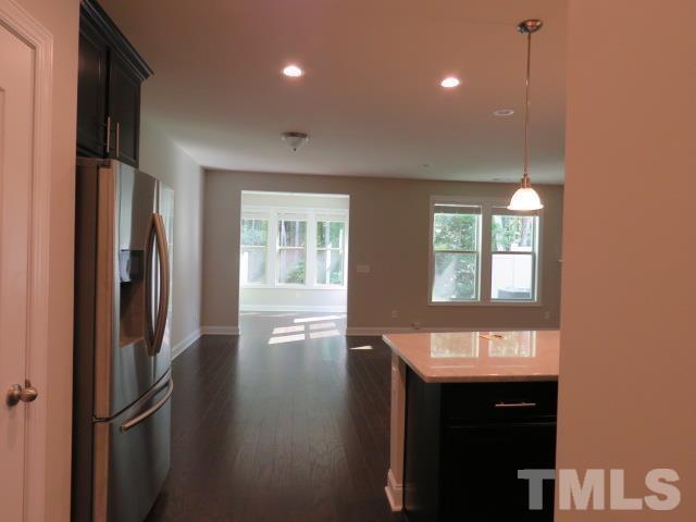 1517 Catch Fly Lane Durham, NC 27713 - Photo 13 of 44 a kitchen with stainless steel appliances a refrigerator and a sink