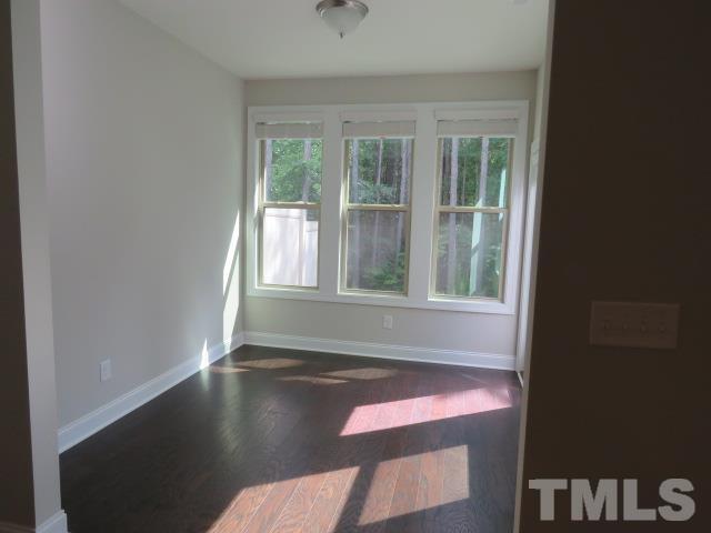 1517 Catch Fly Lane Durham, NC 27713 - Photo 15 of 44 a view of empty room with wooden floor and fan