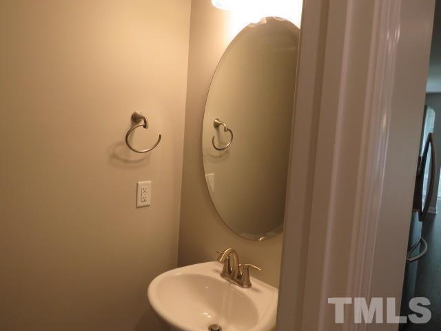 1517 Catch Fly Lane Durham, NC 27713 - Photo 18 of 44 a bathroom with a sink and mirror