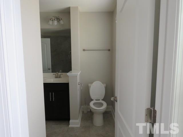 1517 Catch Fly Lane Durham, NC 27713 - Photo 29 of 44 a bathroom with a toilet sink and mirror