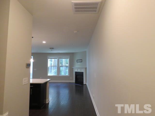 1517 Catch Fly Lane Durham, NC 27713 - Photo 3 of 44 a view of an empty room with wooden floor and a window