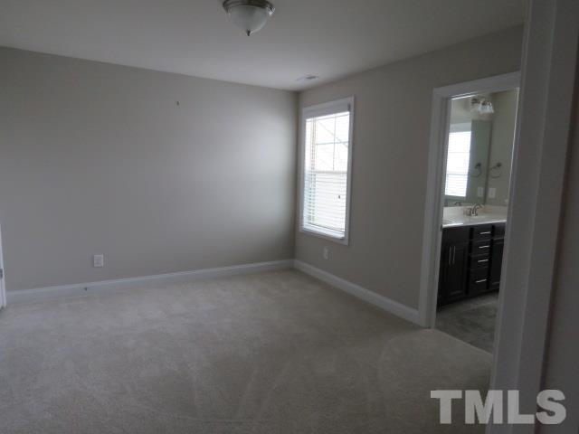 1517 Catch Fly Lane Durham, NC 27713 - Photo 32 of 44 an empty room with windows and closet