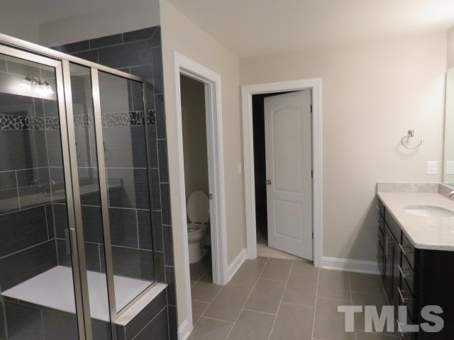 1517 Catch Fly Lane Durham, NC 27713 - Photo 40 of 44 a bathroom with a shower and a sink