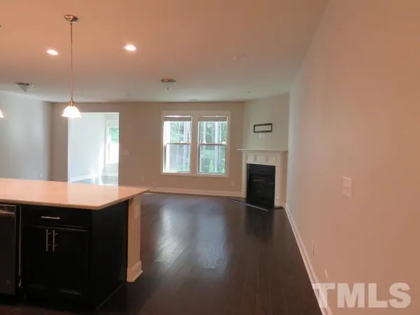 a view of a kitchen with a sink and a window