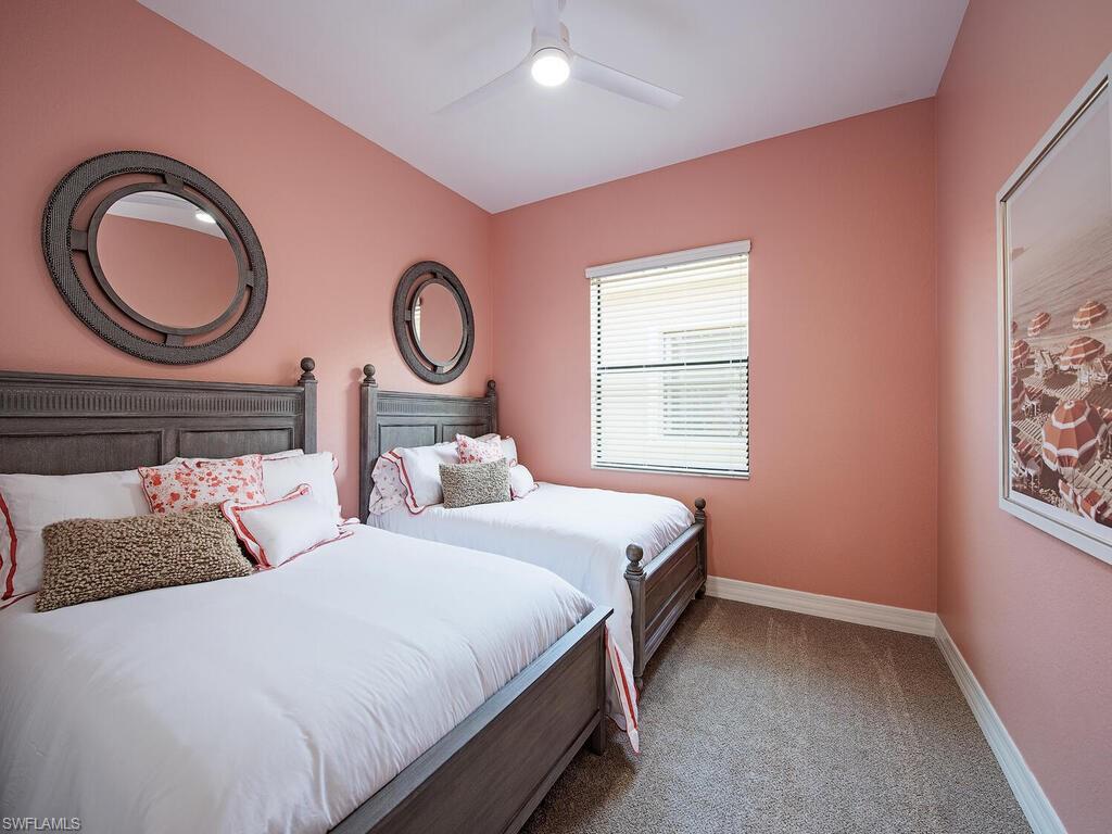 3487 Pacific Drive Naples, FL 34119 - Photo 12 of 33 a bedroom with bed and a window