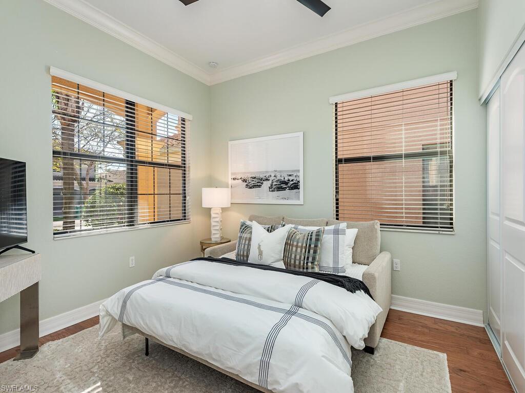 3487 Pacific Drive Naples, FL 34119 - Photo 14 of 33 a bedroom with a bed and a window