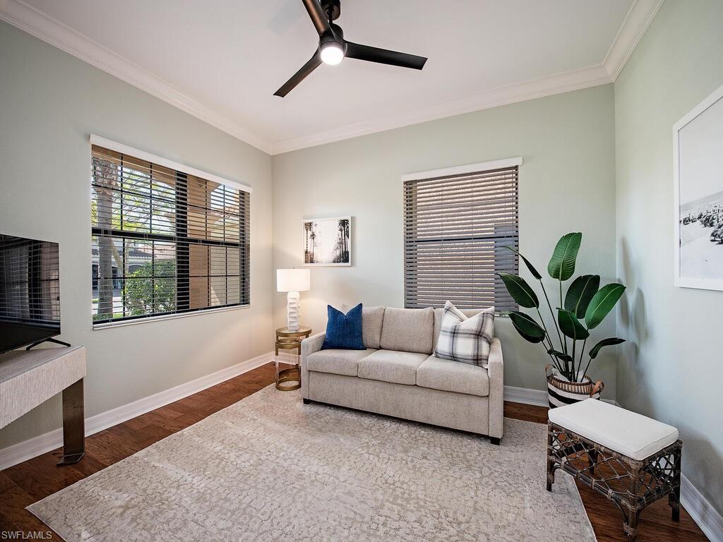 3487 Pacific Drive Naples, FL 34119 - Photo 15 of 33 a living room with furniture and a potted plant