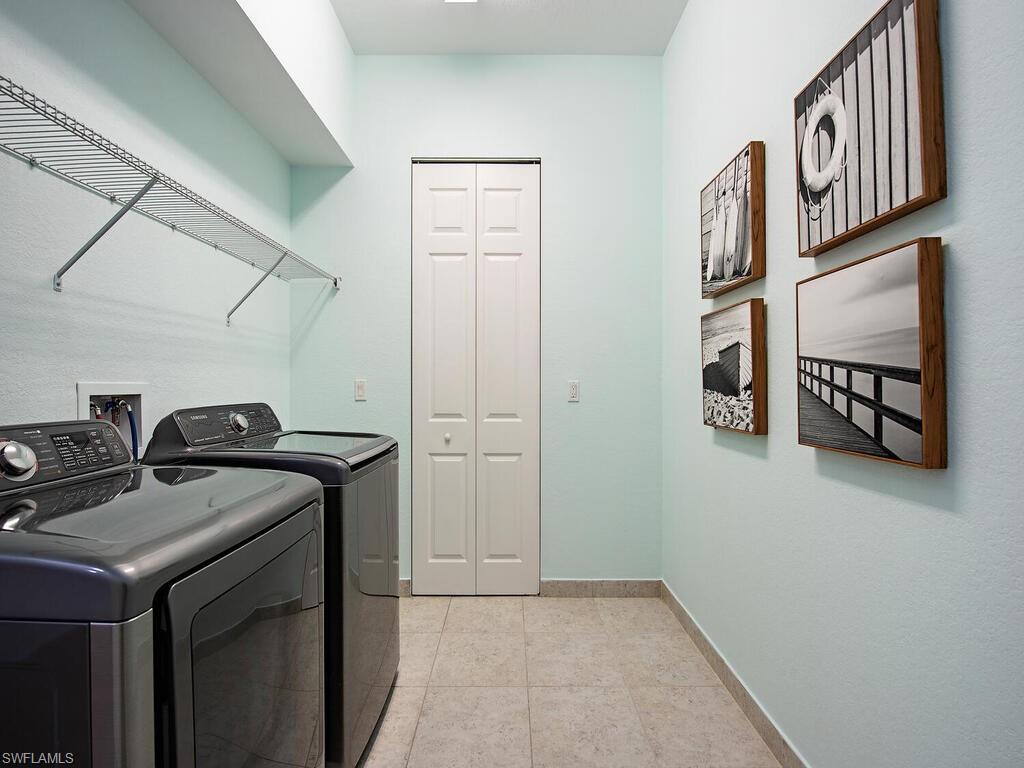 3487 Pacific Drive Naples, FL 34119 - Photo 16 of 33 a utility room with dryer and washer