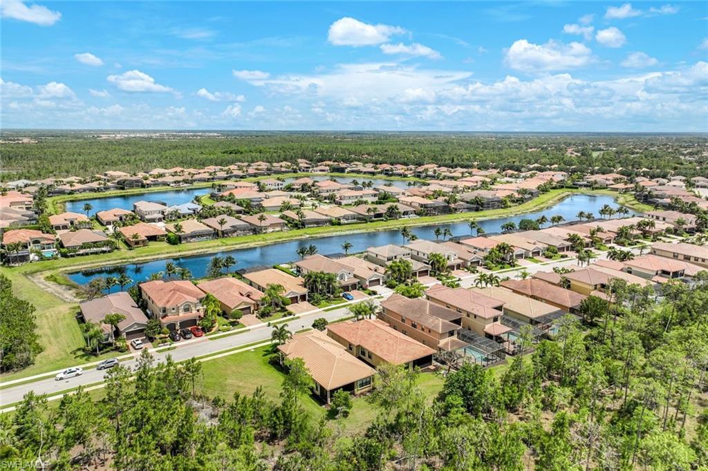 3487 Pacific Drive Naples, FL 34119 - Photo 20 of 33 an aerial view of residential houses with outdoor space
