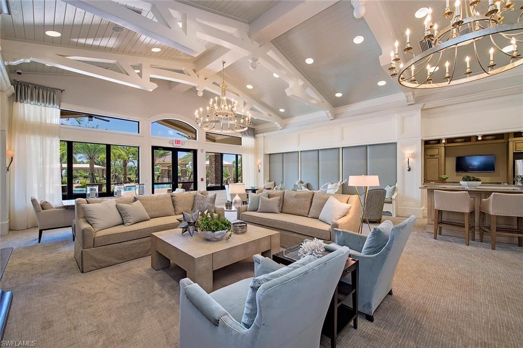 3487 Pacific Drive Naples, FL 34119 - Photo 24 of 33 a living room with furniture and a large window