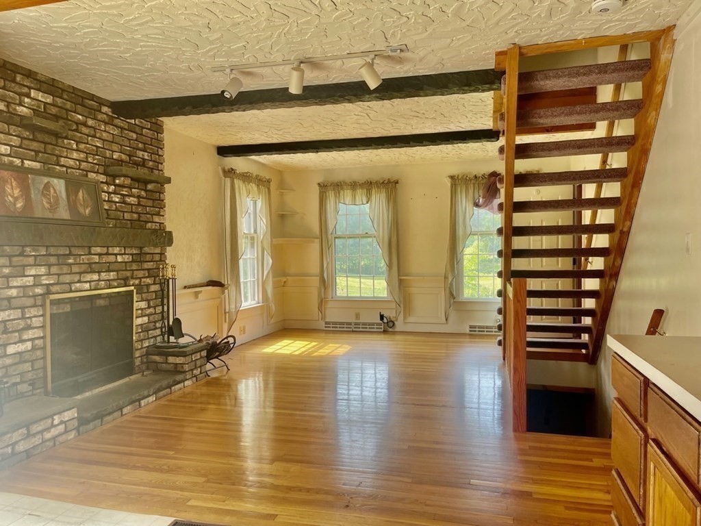128 North Street Rochester, MA 02770 - Photo 13 of 32 a view of livingroom with furniture and fireplace