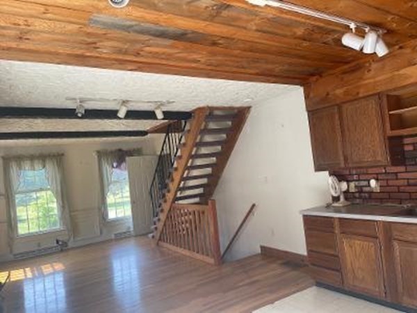 128 North Street Rochester, MA 02770 - Photo 14 of 32 a kitchen with wooden floors and sink