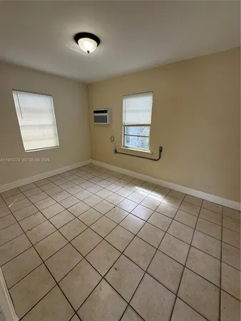 a view of an empty room and window