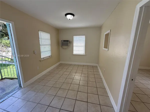 a view of an empty room with windows
