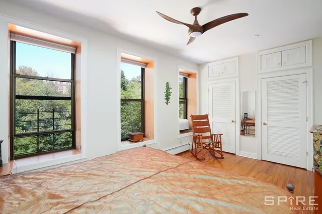 a view of a livingroom with furniture and a window