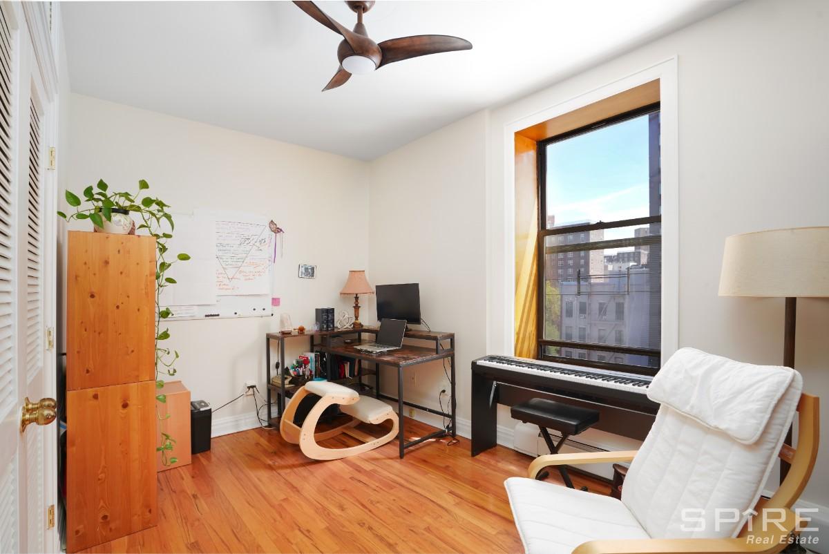 370 St Nicholas Avenue, Unit 5B Manhattan, NY 10027 - Photo 7 of 23 a view of a workspace with furniture and a window