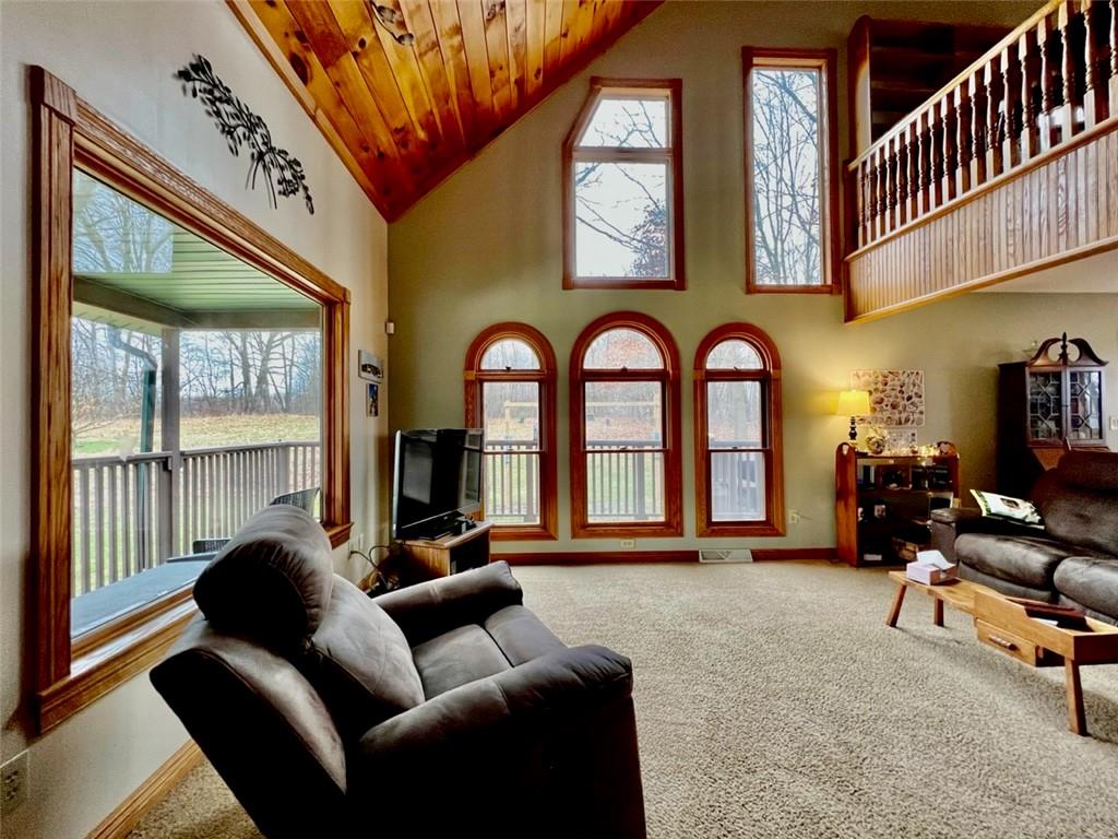 84 Mc Ewen Road Mercer, PA 16137 - Photo 5 of 18 a living room with furniture a chandelier and a large window