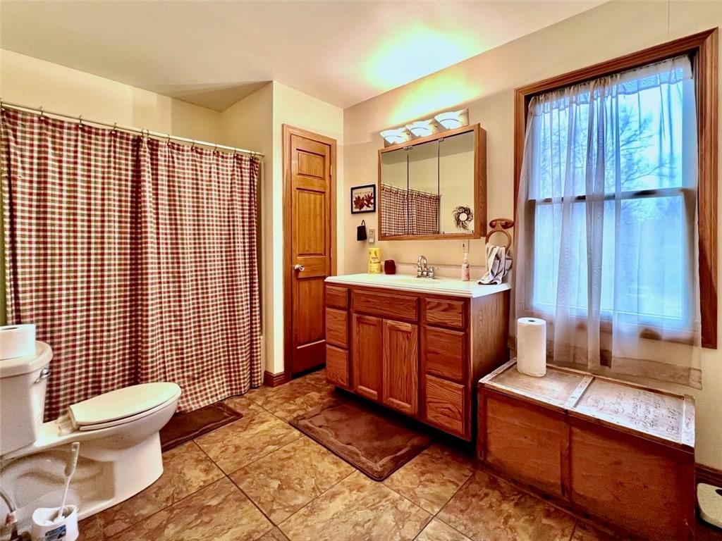 84 Mc Ewen Road Mercer, PA 16137 - Photo 10 of 18 a bathroom with a sink toilet and shower