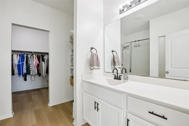 a bathroom with a sink double vanity and a mirror
