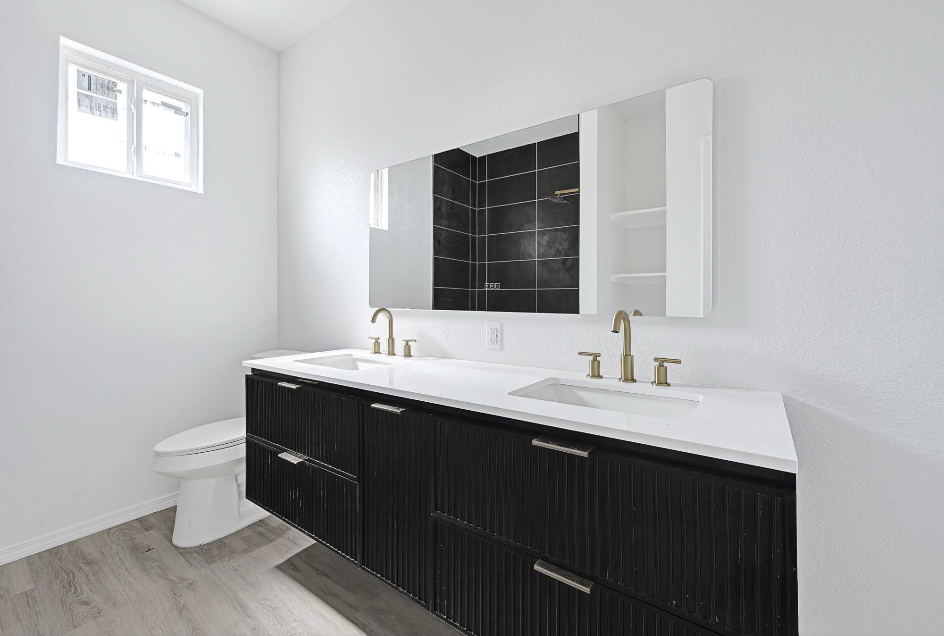 7939 Goode Street Houston, TX 77012 - Photo 11 of 14 a bathroom with a sink and a toilet