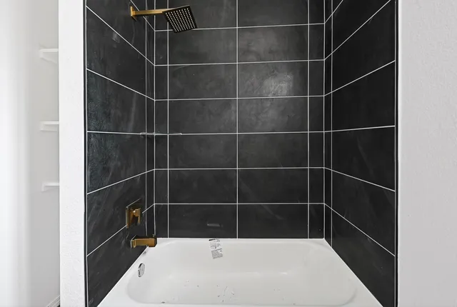 a small space with a window and wooden floor