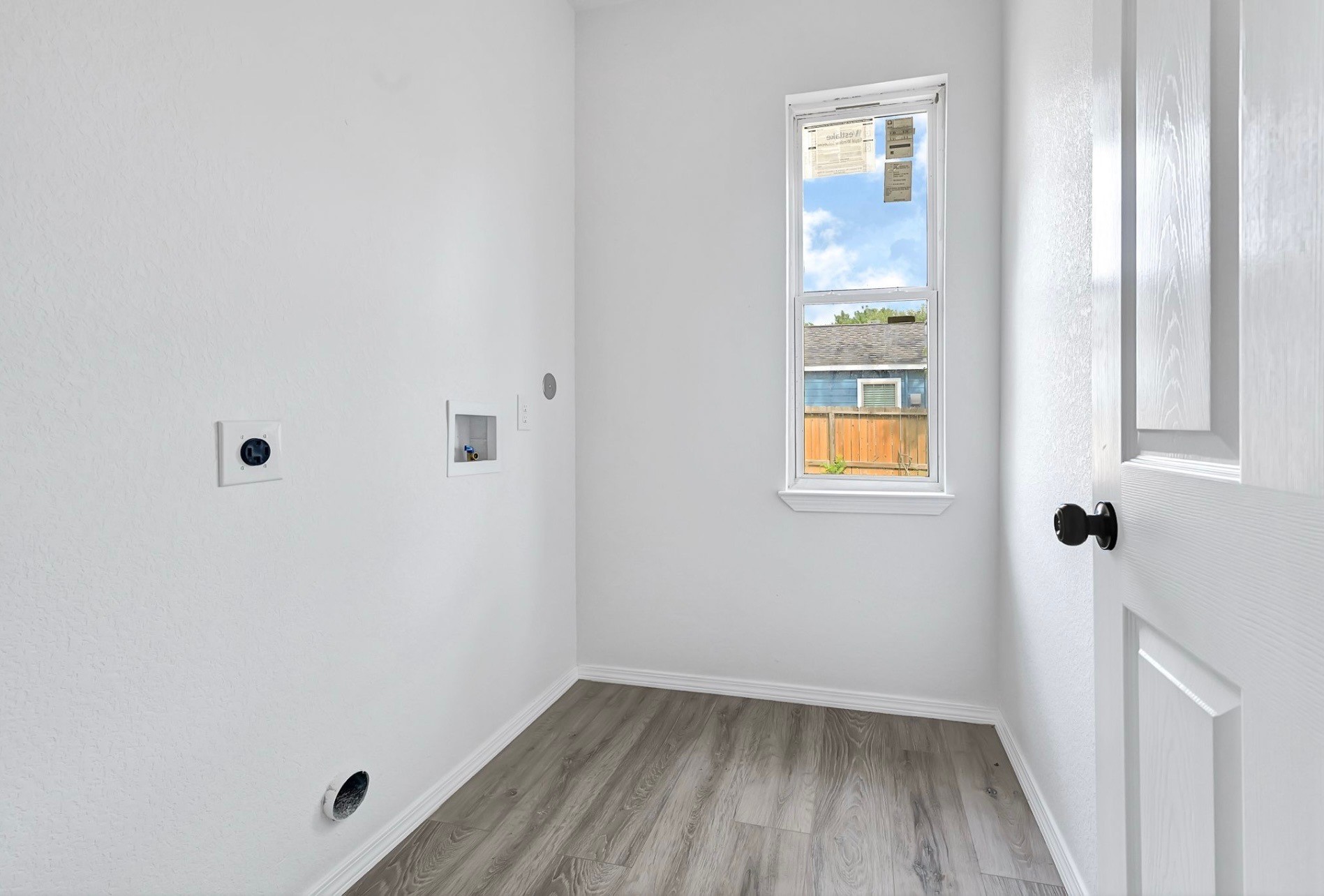 7939 Goode Street Houston, TX 77012 - Photo 13 of 14 a small space with a window and wooden floor
