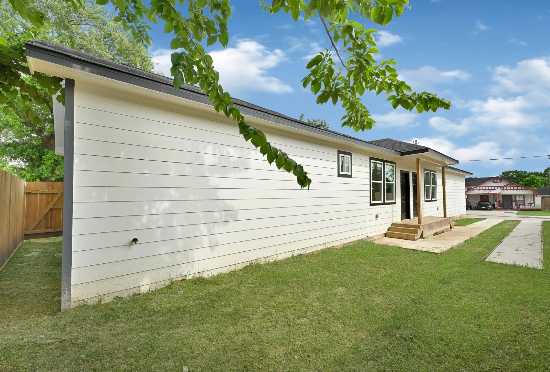 7939 Goode Street Houston, TX 77012 - Photo 2 of 14 a front view of a house with garden