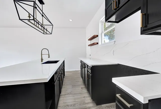 a kitchen with a sink and cabinets