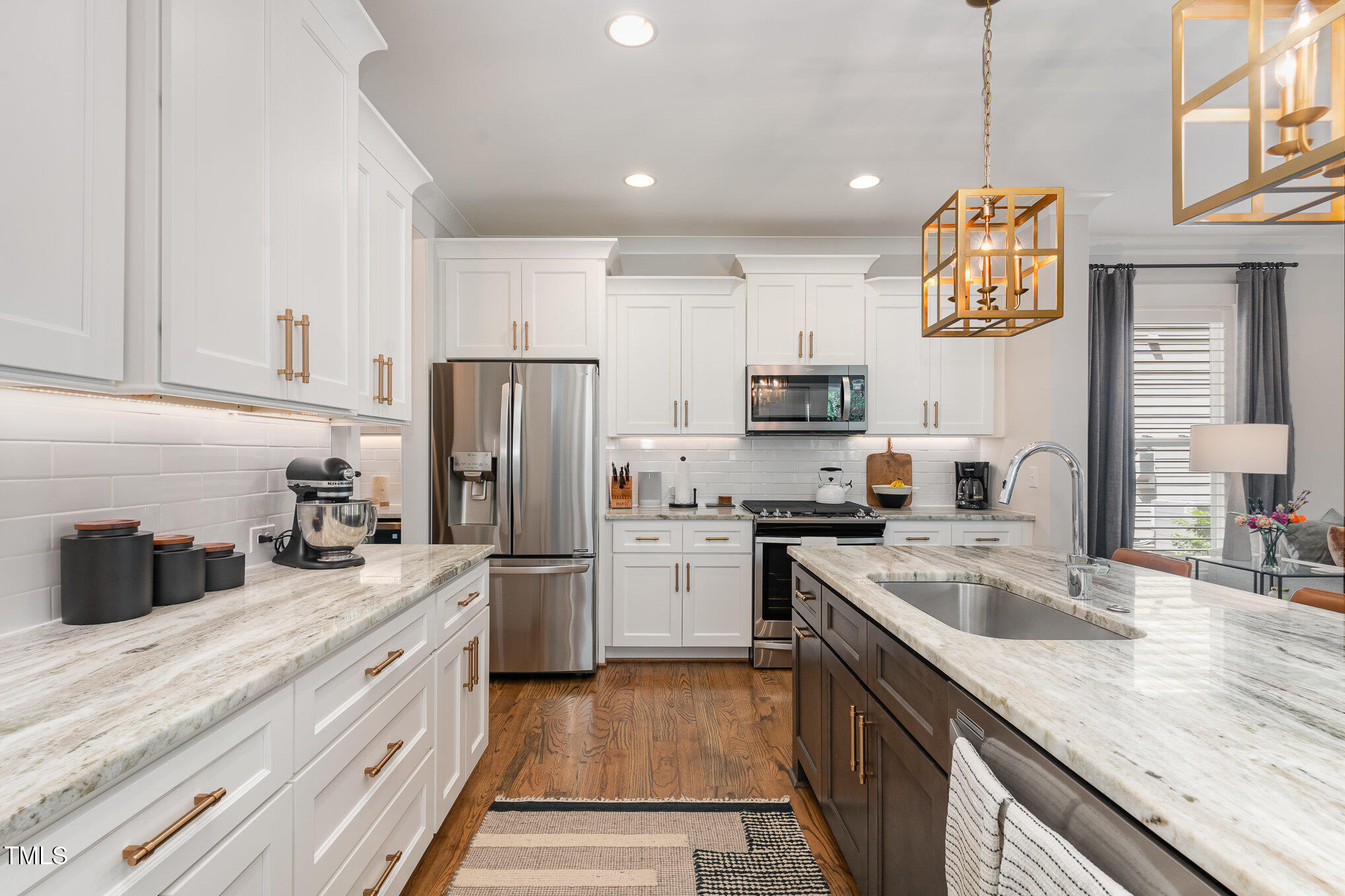 1422 Banbury Road Raleigh, NC 27607 - Photo 13 of 48 a kitchen with a sink stove and refrigerator